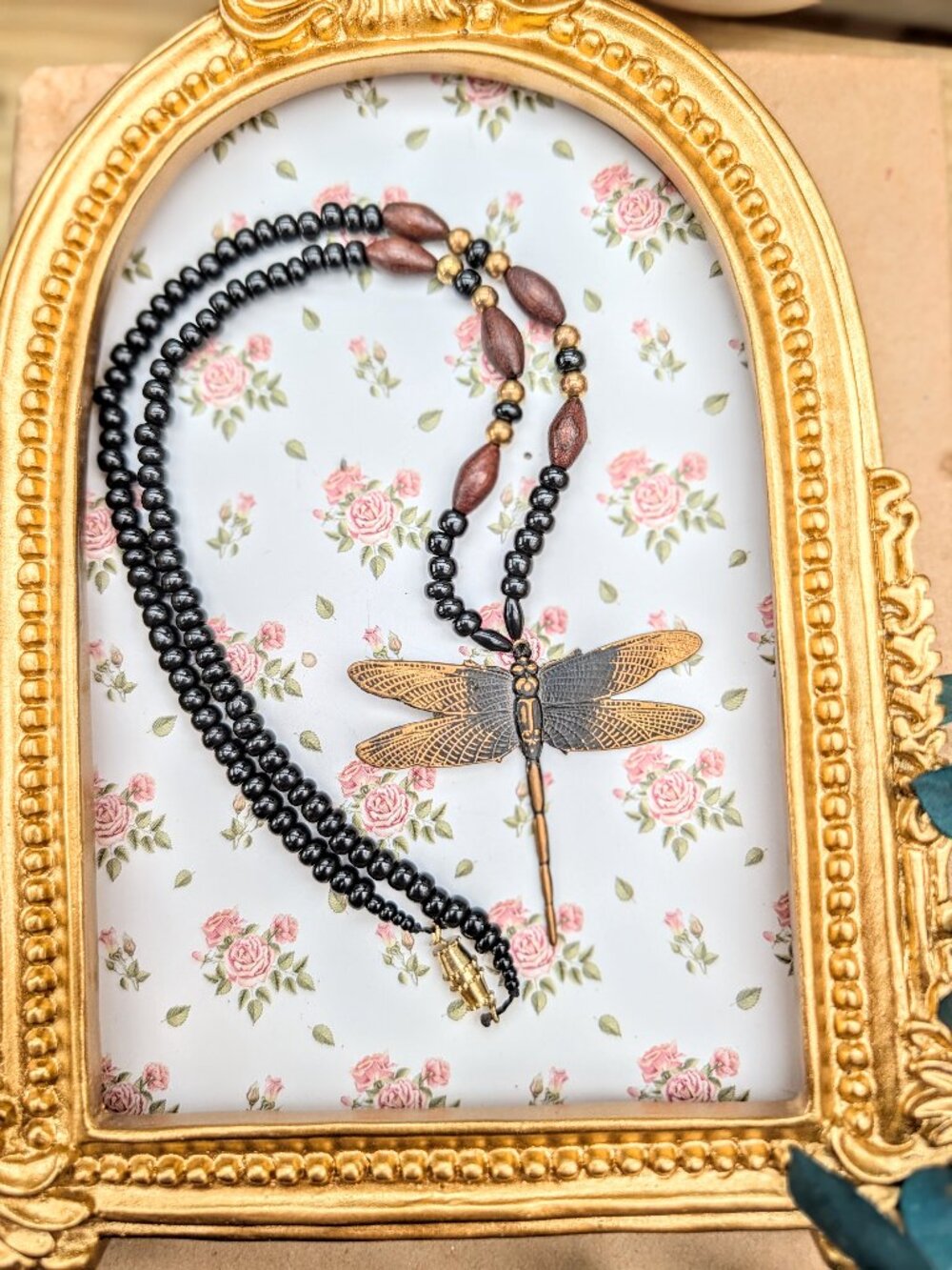 Vintage antique gold tone dragonfly pendant on black & wood beaded necklace